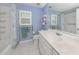 Well-lit bathroom with a shower and tub combo and white tiled flooring at 346 Roseling Cir, Venice, FL 34293