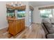 Cozy dining area with wood floors, natural lighting, and views of the backyard at 346 Roseling Cir, Venice, FL 34293