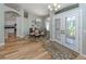 Inviting dining room with wood floors, chandelier, and direct access to the kitchen and front door at 346 Roseling Cir, Venice, FL 34293