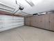 Spacious garage with epoxy floors and built-in cabinets for ample storage at 346 Roseling Cir, Venice, FL 34293