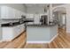 Spacious kitchen with stainless steel appliances, granite countertops, and a large island for meal preparation at 346 Roseling Cir, Venice, FL 34293
