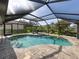 Screened-in pool area with a serene view of the surrounding lush landscaping at 346 Roseling Cir, Venice, FL 34293