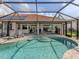 Beautiful screened pool area with a patio, perfect for relaxation and entertaining at 346 Roseling Cir, Venice, FL 34293