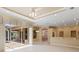 Spacious living area with tile flooring, recessed lighting, and sliding glass doors to the outdoor patio at 355 Swallow Cir, Venice, FL 34285