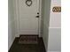 A welcoming white front door with a decorative wreath and a 'HOME' doormat at 3730 Cadbury Cir # 703, Venice, FL 34293