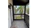 Tiled porch with black railings offering exterior views and natural light at 3862 59Th W Ave # 4180, Bradenton, FL 34210