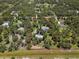 Bird's eye view showing the property lines, house, and surrounding trees and landscape at 3863 Albin Ave, North Port, FL 34286