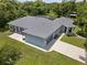 Birds eye view of single story home with gray roof, driveway, and well-maintained yard at 3863 Albin Ave, North Port, FL 34286