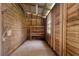 Small storage area inside barn with wood plank walls and a window at 3863 Albin Ave, North Port, FL 34286