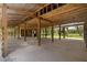 Spacious barn interior with exposed wooden beams and concrete flooring at 3863 Albin Ave, North Port, FL 34286