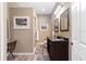 Bathroom with double sinks, a vanity, wood floors, and a shower providing a functional design at 3863 Albin Ave, North Port, FL 34286