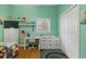 Bedroom with playful decor, hardwood floor, and an organized desk area at 3863 Albin Ave, North Port, FL 34286