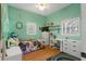 Charming bedroom with playful decor, hardwood floor, and ample natural light at 3863 Albin Ave, North Port, FL 34286