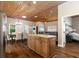 A kitchen island is centrally located, with views of the dining room and living room, great for entertaining at 3863 Albin Ave, North Port, FL 34286