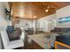 Spacious living room with beautiful flooring, wooden ceilings, a ceiling fan, and an open concept at 3863 Albin Ave, North Port, FL 34286