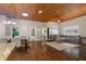 View of living room, dining, and kitchen area with wood floors and a wood ceiling at 3863 Albin Ave, North Port, FL 34286