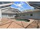 Enclosed pool featuring a partially covered patio, perfect for entertaining at 3863 Albin Ave, North Port, FL 34286