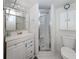 Bathroom features a walk in shower, vanity, and toilet at 401 Airport E Ave # 304, Venice, FL 34285