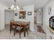 Charming dining area with a wooden table, seating for four, and a kitchen view, enhances the dining experience at 401 Airport E Ave # 304, Venice, FL 34285