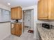 Bright kitchen with lots of cabinet space and granite countertops at 401 Airport E Ave # 304, Venice, FL 34285