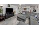 Expansive living room offers a relaxing atmosphere with a view of dining area with plenty of natural light at 401 Airport E Ave # 304, Venice, FL 34285