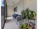 Inviting patio with comfortable seating, ceiling fan, tile floor, and lush plant life at 401 Airport E Ave # 304, Venice, FL 34285
