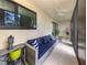 Relaxing patio with comfortable seating, ceiling fan, tile floor, and natural light at 401 Airport E Ave # 304, Venice, FL 34285
