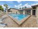 Sparkling community pool with clear blue water and deck, perfect for hot summer days at 401 Airport E Ave # 304, Venice, FL 34285