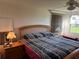 Bedroom with natural light and comfortable furnishing at 411 Vasto Dr, Venice, FL 34285