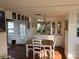 Bright dining area with built-in cabinets and an adjacent outdoor entrance at 411 Vasto Dr, Venice, FL 34285