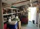 Well-organized garage with storage shelves, work bench, and various tools at 411 Vasto Dr, Venice, FL 34285