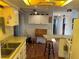 Efficient kitchen layout with ample counter space and view into adjacent rooms at 411 Vasto Dr, Venice, FL 34285
