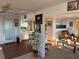 Inviting living room with laminate flooring, bright natural light, and comfortable decor at 411 Vasto Dr, Venice, FL 34285
