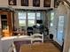 Bright living area with large windows offering ample natural light and exterior views at 411 Vasto Dr, Venice, FL 34285
