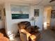 Inviting space featuring comfortable recliner chair, decor, and a calming color scheme at 411 Vasto Dr, Venice, FL 34285