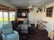 The covered porch provides a place to relax, along with a ceiling fan and outdoor decorations at 411 Vasto Dr, Venice, FL 34285