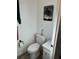 The second half bath features a toilet, vanity, and towel rack at 411 Vasto Dr, Venice, FL 34285