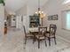 Formal dining room with decorative lighting fixture and space for a dining set at 4176 Summertree Rd, Venice, FL 34293