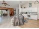 Stylish kitchen with an island, stainless steel appliances, white cabinets, and an open floor plan at 4176 Summertree Rd, Venice, FL 34293