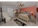 Main bedroom features a ceiling fan, accent wall, and neutral-toned furniture at 4176 Summertree Rd, Venice, FL 34293
