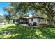 Spacious backyard featuring a patio and a grill, perfect for outdoor gatherings at 4227 Blossom Rd, Venice, FL 34293