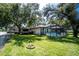 Large backyard with a screened-in pool and an RV on the side at 4227 Blossom Rd, Venice, FL 34293