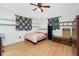 Cozy bedroom features wood floors, natural light, and ample storage at 4227 Blossom Rd, Venice, FL 34293