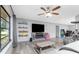 Spacious living room with ceiling fan, modern flooring, and comfortable layout at 4227 Blossom Rd, Venice, FL 34293