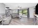 Inviting living room features a cozy seating area, large windows, and modern flooring at 4227 Blossom Rd, Venice, FL 34293