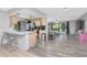 Open floor plan connects living room and kitchen creating a spacious and inviting atmosphere at 4227 Blossom Rd, Venice, FL 34293
