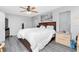 Spacious main bedroom with a ceiling fan, a king-size bed and natural light at 4227 Blossom Rd, Venice, FL 34293
