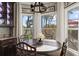Breakfast nook area with views of lush tropical landscaping at 4260 Wordsworth Way, Venice, FL 34293