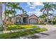 Charming single-story home with well-maintained landscaping, a paver driveway, and a two-car garage at 4260 Wordsworth Way, Venice, FL 34293