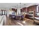 Spacious kitchen featuring dark wood cabinetry, granite countertops, and seating at the island at 4260 Wordsworth Way, Venice, FL 34293